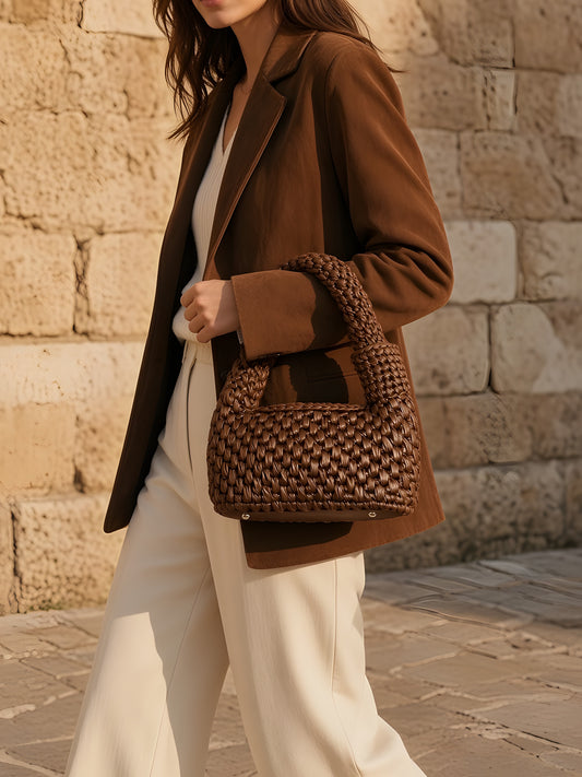Model carrying the Yazli Julie bag in Brown handwoven leather